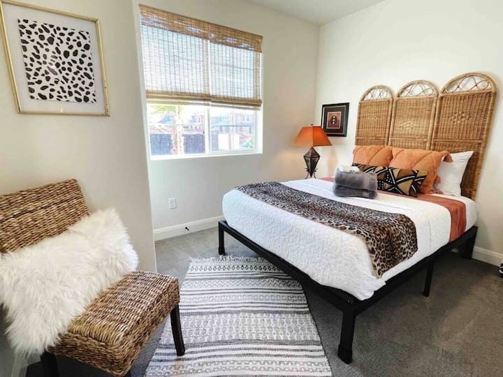 Bedroom on the main floor with a queen bed.