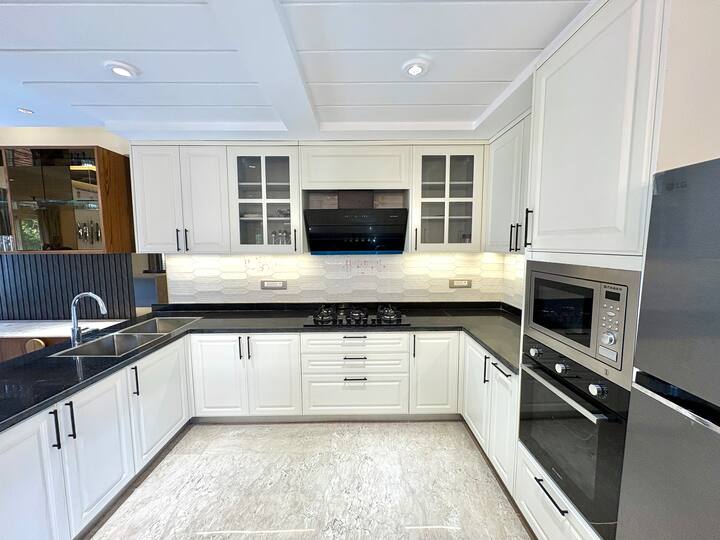 A stylish modern luxe kitchen featuring premium appliances and thoughtfully designed functionality.