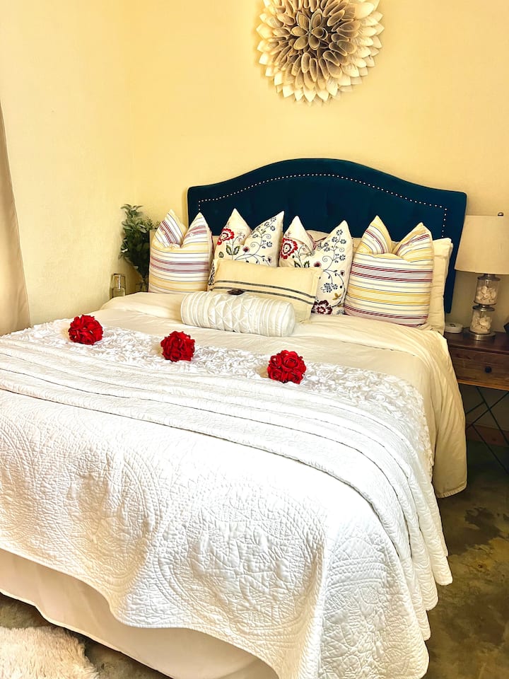 Organic lush Queen bed. Closet with optional lock. Privacy curtains on inside & out of opening (no lock.) Charging station, outlets & sound machine. Paper flower sculpture made from pages of love poems. Desk/vanity w/ light up mirror. Pillow hamper.