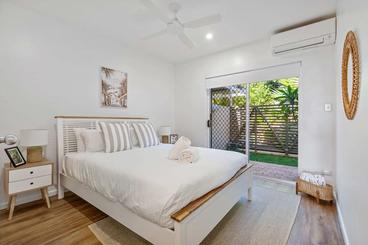 Master bedroom with private courtyard access for a peaceful retreat