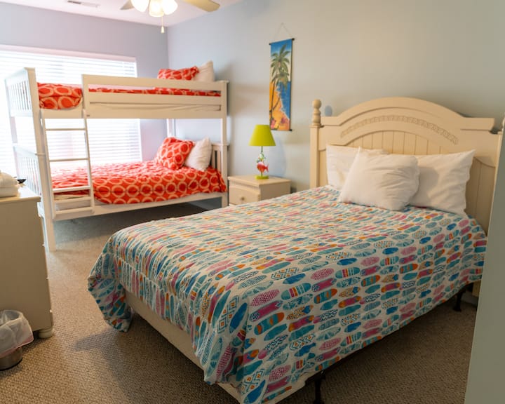 Full size bed with a full over full bunk bed