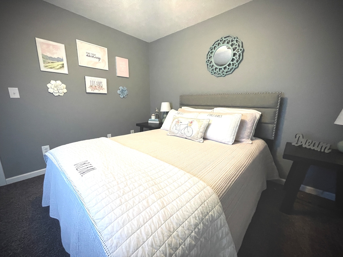 Queen Bedroom with walk in closet. Extra bedding in closet. Kids toys and full size mirror 