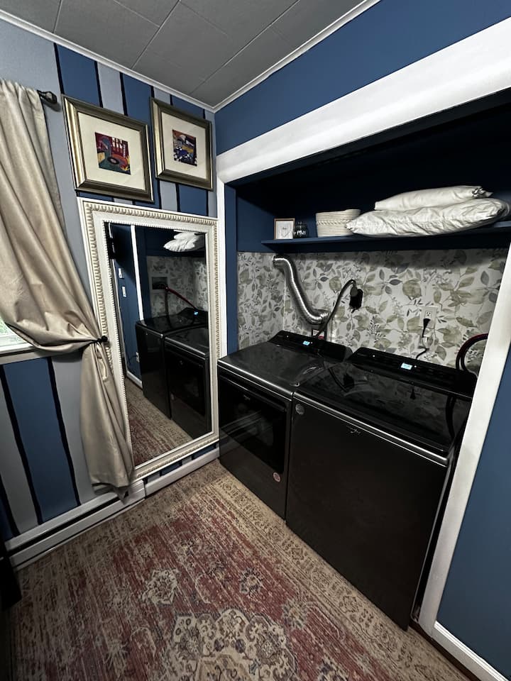 Bunk beds with sheets, pillows, duvets. Has pull out trundle under bottom bunk(full over full twin trundle) . Smart TV. Private 1/2 bath in this room, fan, washer & dryer 