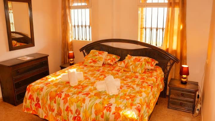 The master bedroom 1 with a double bed and plenty of closet space has a spacious ensuite bathroom 1