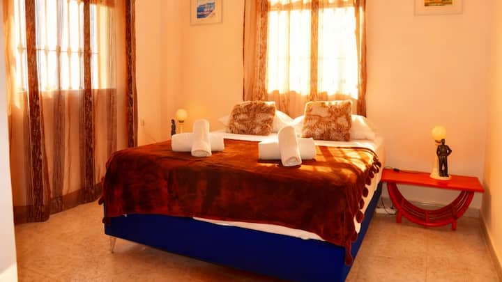 Bedroom 2 on this floor with double bed and plenty of closet space has views of the pool, mountains and sea.