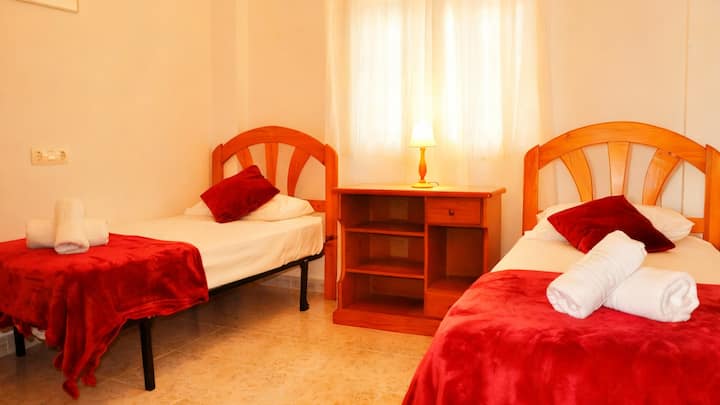 Bedroom 3 with two single beds also has ample closet space.