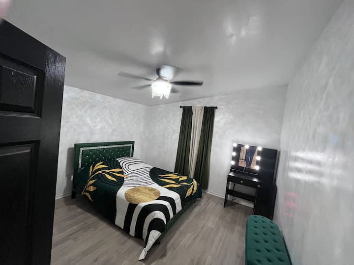 Bedroom 5 Queen Bed with lounge space, vanity and pull out sofa