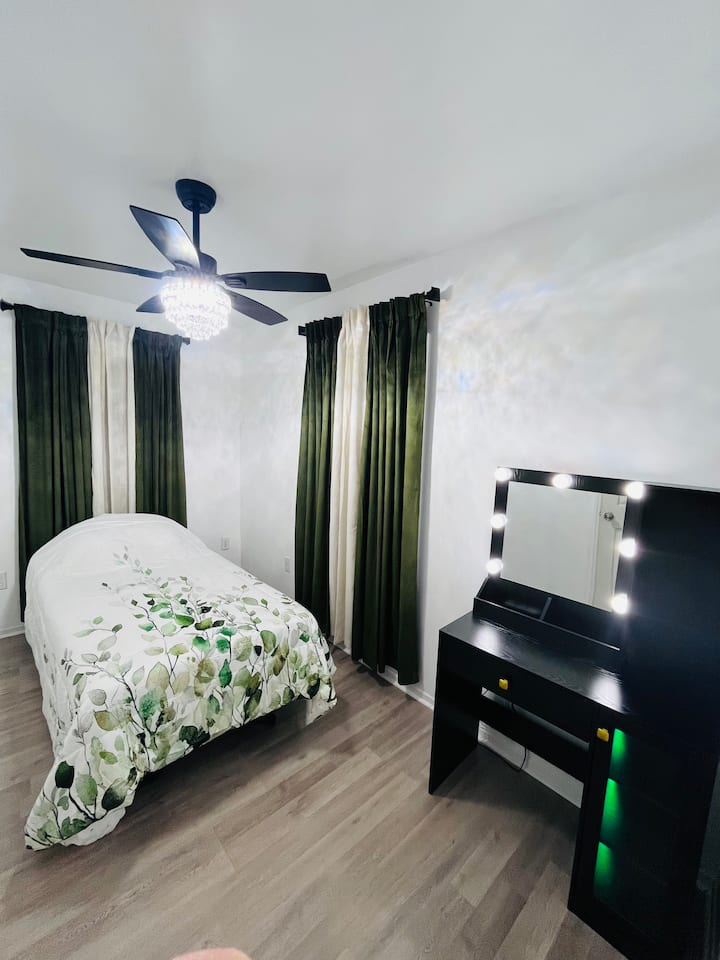 Bedroom 6 with twin bed, and vanity.  Accessible for those with some disabilities.