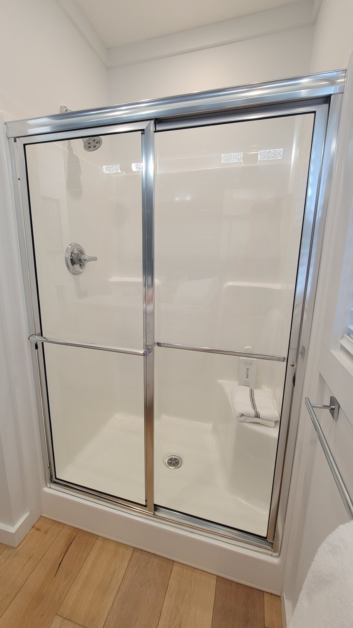 Shower with bench. Bath essentials, including body wash & shampoo are provided. at Juan Love in Santa Rosa Beach