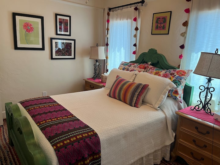 double bed with twin nightstands and reading lamps
