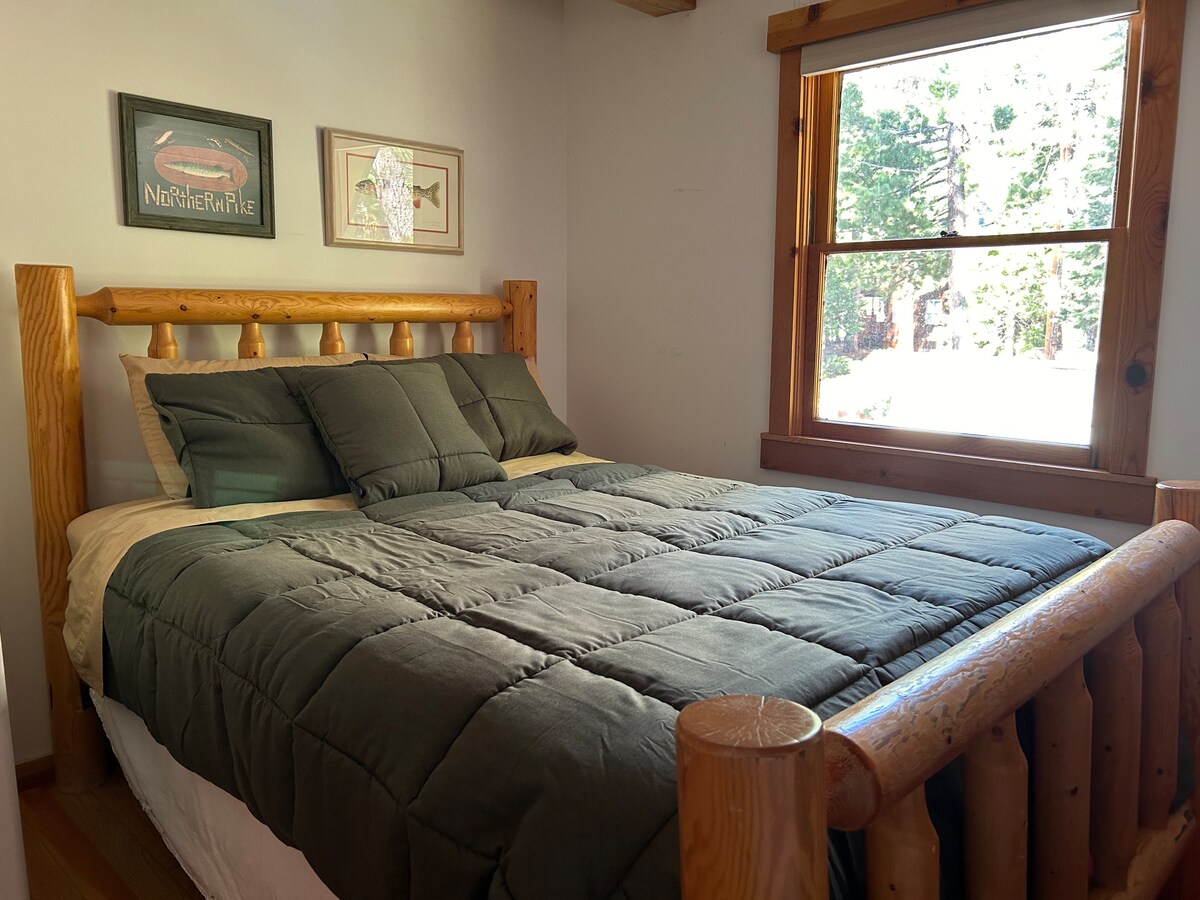 This is one our four bedrooms & features a Queen log bed on the second floor. 