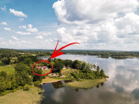 House by lake with boat