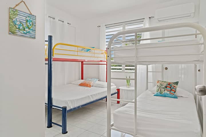 Bunk Room: Cheerful space with colorful bunk beds perfect for kids and friends to enjoy together!