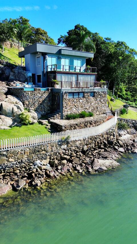The beachfront house with private beach access.