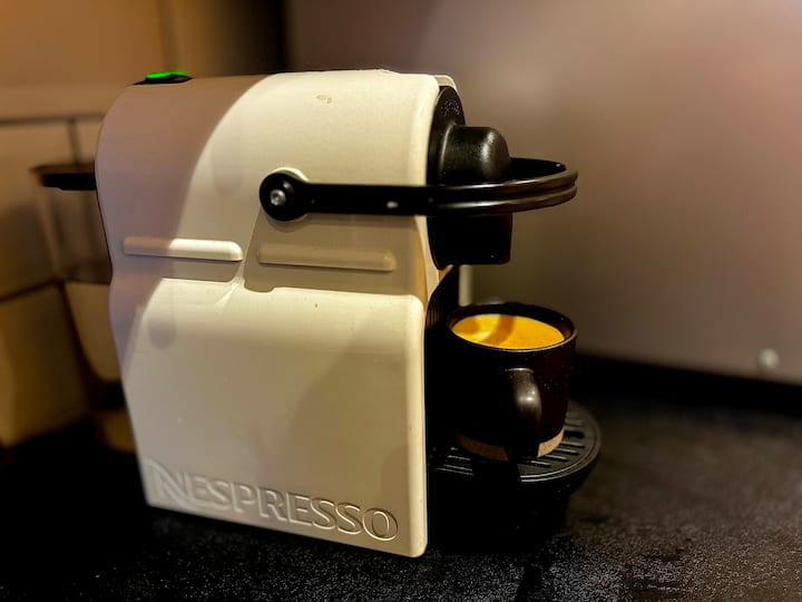 Bright airy kitchen with fresh flowers and morning light flooding through the window