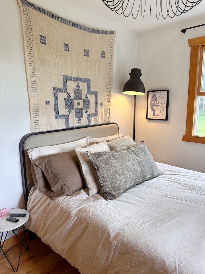 The downstairs bedroom has a full size bed with a dresser and closet. This room also has a great view of the sunset perfect for naps! 