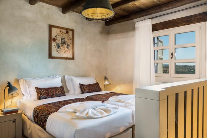 Stylish twin bedroom, perfect for relaxation and a restful stay.