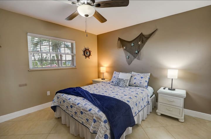 Bedroom Retreat: Relax in a coastal-themed room with plush bedding and tropical views!