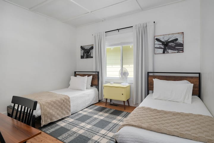 A flexible room that works just as well for the kids as it does for adults.. Two separate twin beds give everyone their own space, fan, white noise machine and room-darkening shades help make winding down after a busy day a little easier.