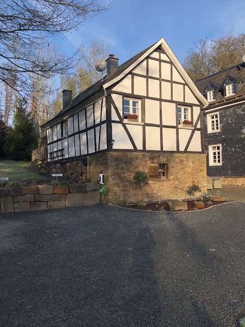 Cozy half-timbered house at the edge of the forest