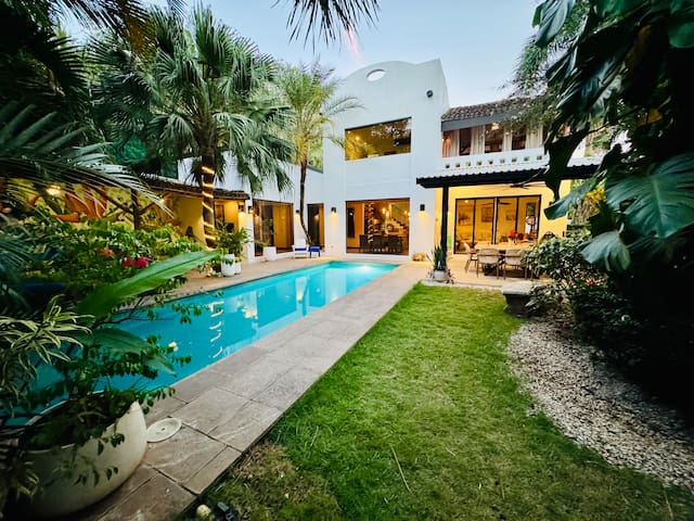 Walk to the beach! 4-bedroom oasis w/ heated pool