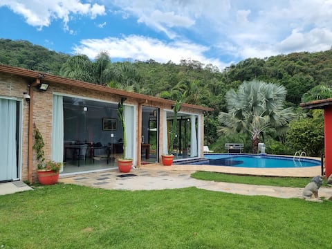 House, farm, between mountains and sea
