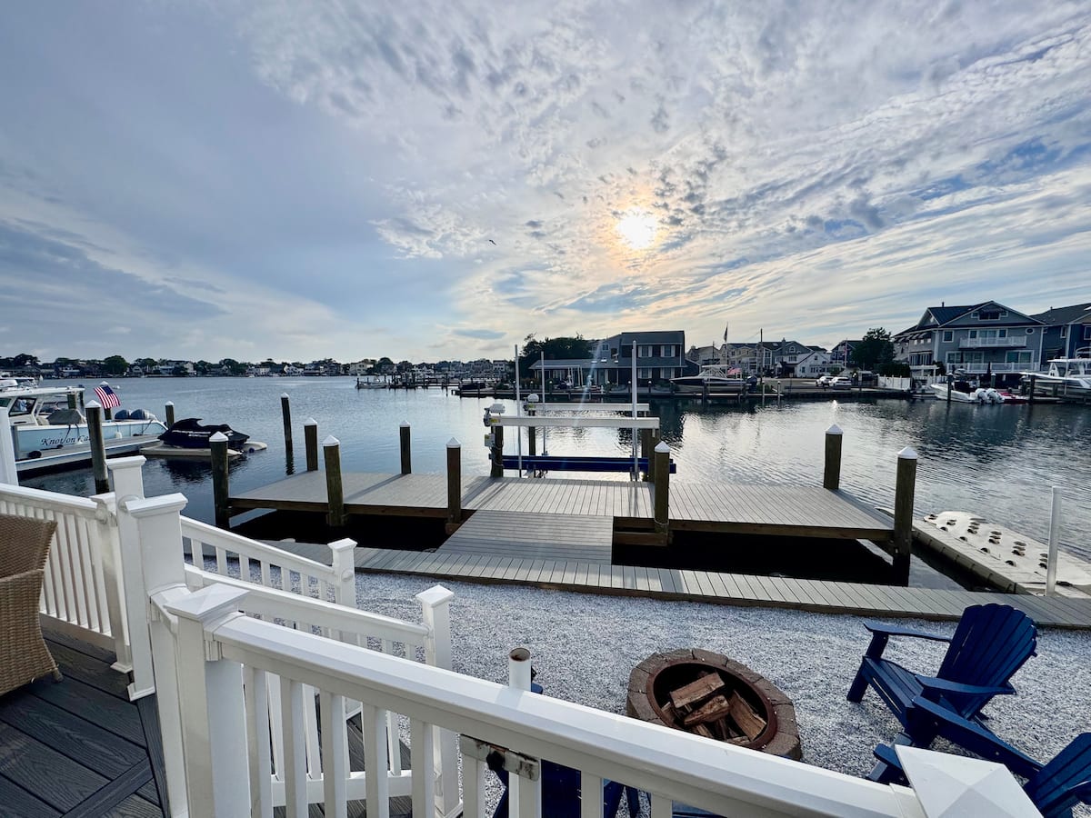 Driveway and backyard with BBQ grill at the Point Pleasant Beach rental with free parking