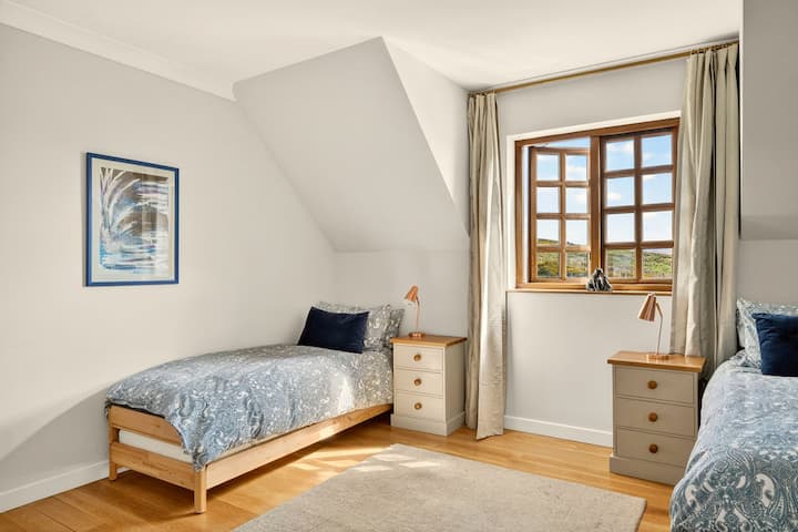 The blue room is great for 2-3 individuals sharing this bright space with its lovely ensuite bathroom.