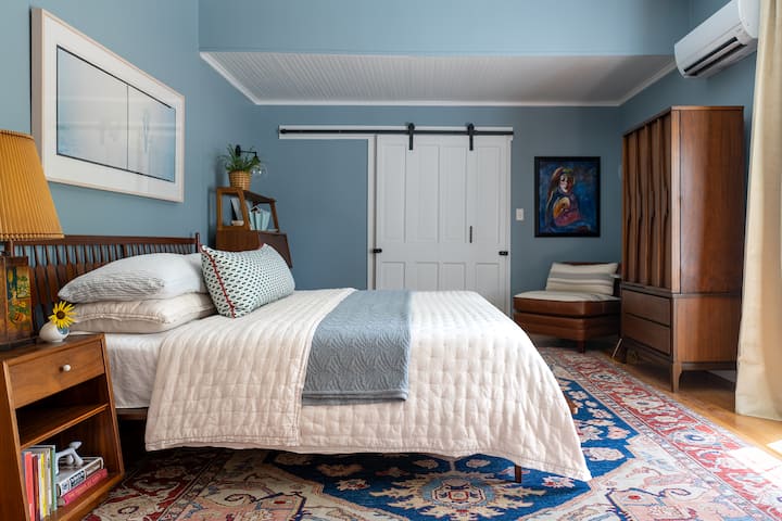 The master bedroom, with its king size bed, is situated toward the back of the house on the first floor. While the main walk-in closet will be locked guests have access to a secondary closet in the room.
