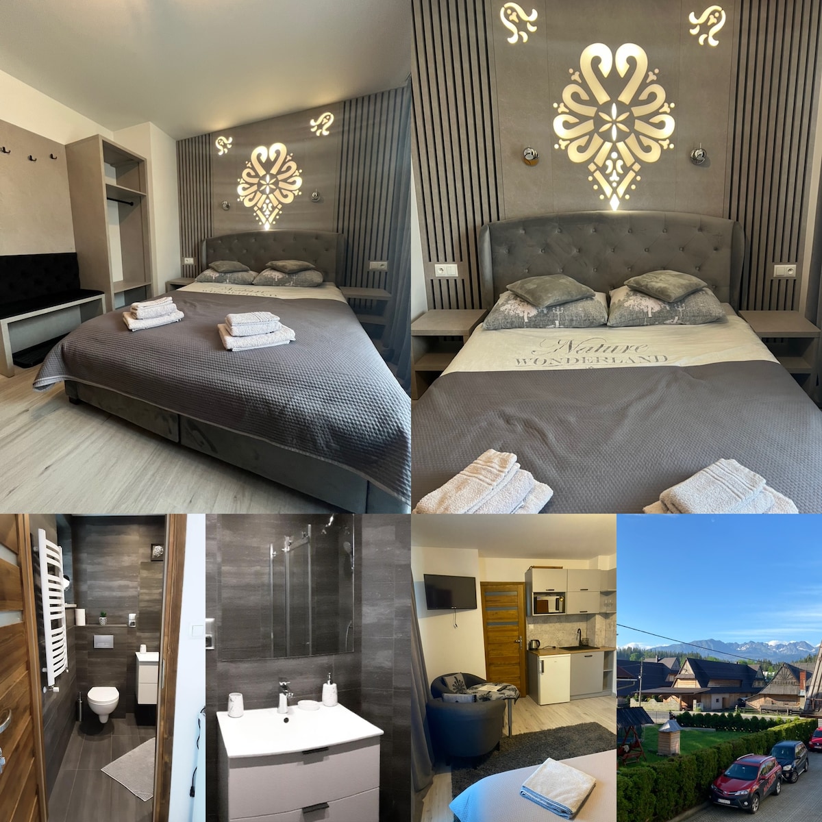 A stylish bedroom features a large bed adorned with neatly arranged towels. Striking wall art enhances the design, complemented by ample natural light from nearby windows. The image also includes views of a modern bathroom, a kitchen space, and a cozy living area, showcasing diverse accommodation features.