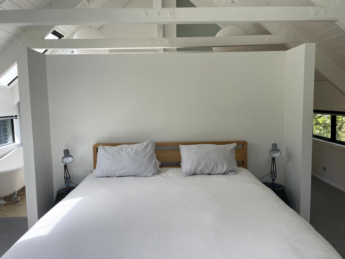 A californian king bed with luxurious bedding sets the scene in the master bedroom which is in its own wing of the lodge. 