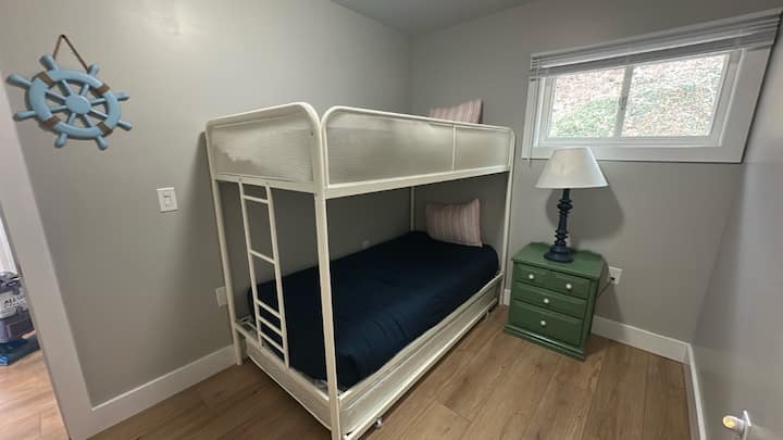 Bunk beds with a trundle underneath.