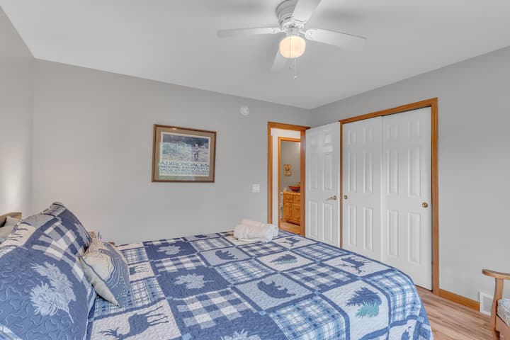 Queen bed, sitting chair, closet, on main floor 