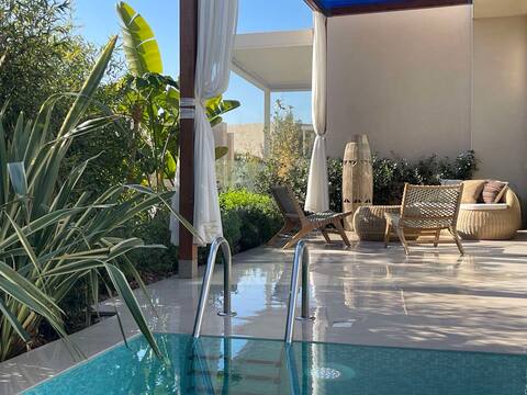 Green Coast beach villa with a pool and sauna