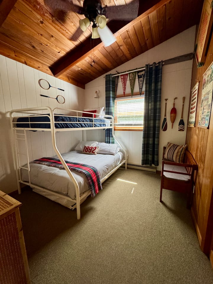 Bedroom 2 includes clean & comfortable bedding, a dresser & closet. The bunk bed has a full size mattress on the bottom, with twin size mattresses on the the top and trundle below.