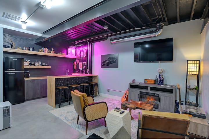 My personal favorite spot, the recreational room. This room is located on the bottom floor of the house and is a perfect hang out spot! It includes a bathroom, pull out couch, TV, and a record player. 