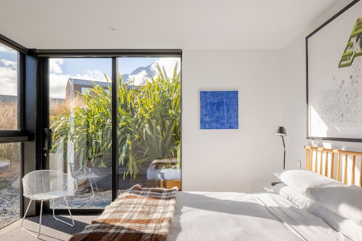 A second downstairs bedroom with Queen size Ercol bed and full amenity including wardrobe, bedside lamps, high quality sheets and feather duvet.