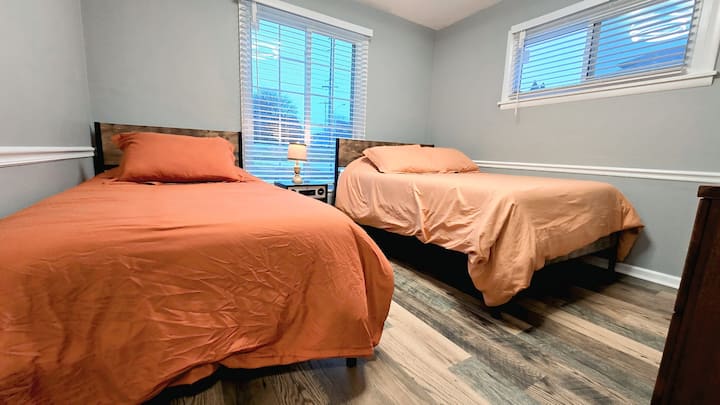 One full and one twin bed with extra pillows and blankets in the closet.