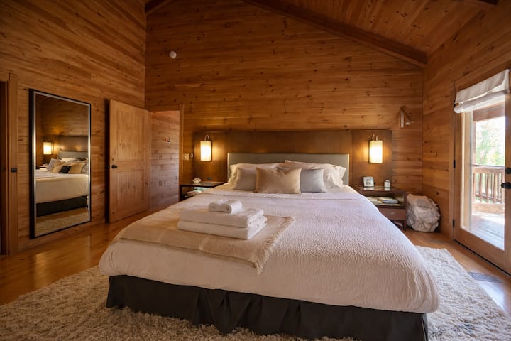 This is your Master bedroom with in suite shower.  After a long day of hiking have a refreshing shower and hop into your comfy king bed.  