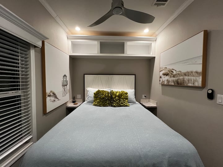 Cozy Queen bed with two side tables