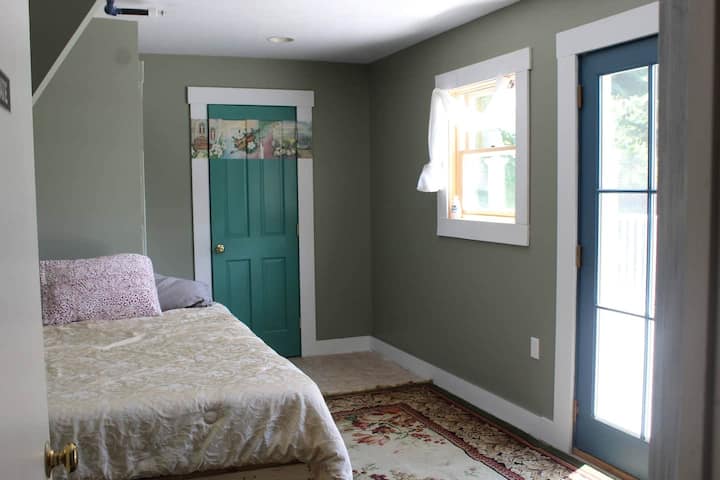 Bedroom in main house w/queen bed and bathroom.