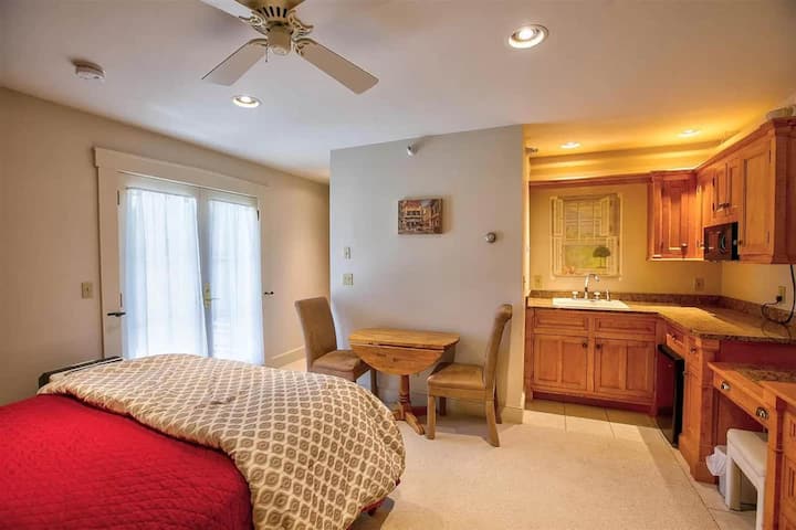 Suite 4 w/ queen bed and bathroom.