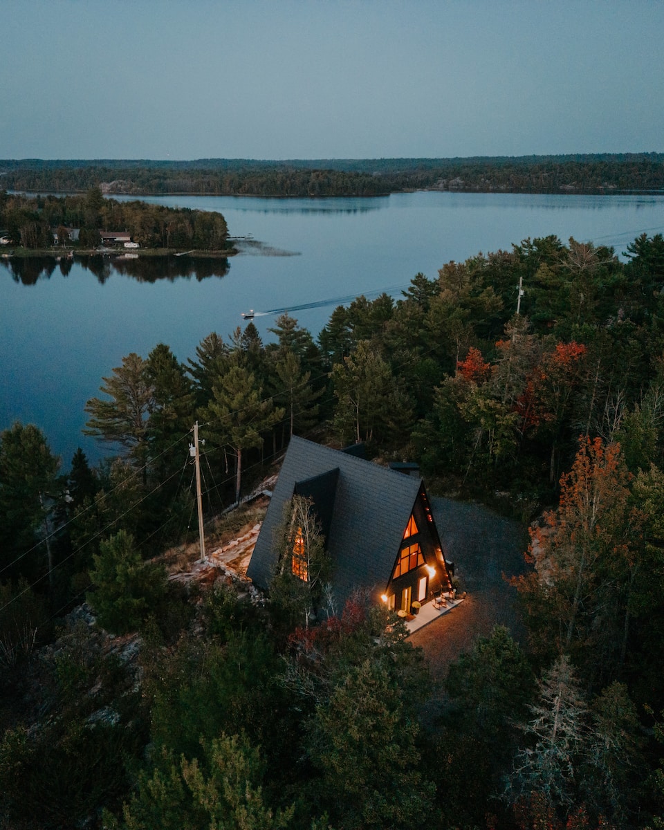 A black timber A-frame above the French River, French River, Ontario, Canada, photo 1 of 10