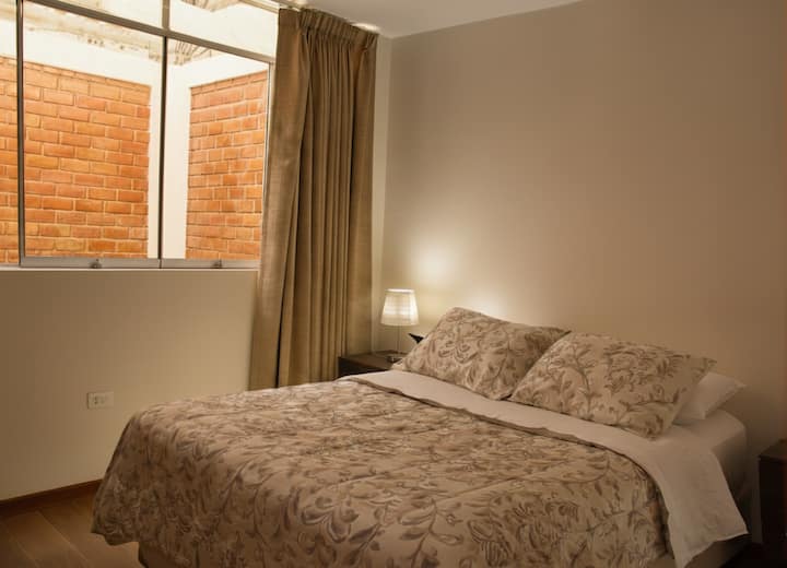 Double bed - Bed linen - Pillows - Clothes storage space - Towels - Clothes hangers - Ironing board and iron - Fan - Desk and chair.