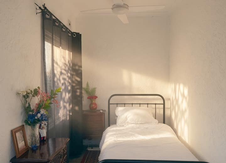 The third bedroom is a flexible space - somewhere to sleep or a comfy sunroom for reading.