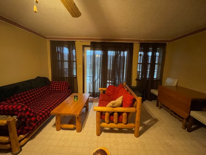 Futon makes into a full size bed.  Love seat could accommodate a child. 