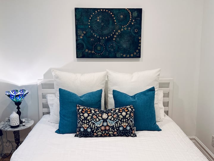 The second bedroom is located on the second floor two steps from the second bath, it features a Queen-sized tempurpedic mattress, 1,000 thread count sheets and overlooks the beautiful back garden.