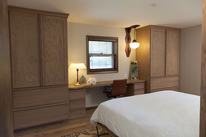 Custom cabinetry and desk in guest bedroom 2 with King Bed.