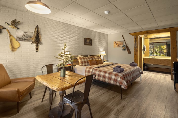 Spacious unit w/ single sink and separate toilet/bathtub/shower. Dining area for two. 