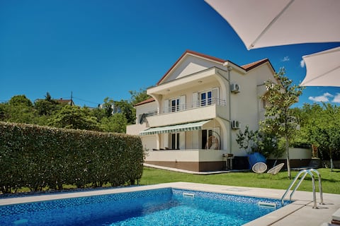Captivating 4BD Villa with Outdoor Pool and Garden